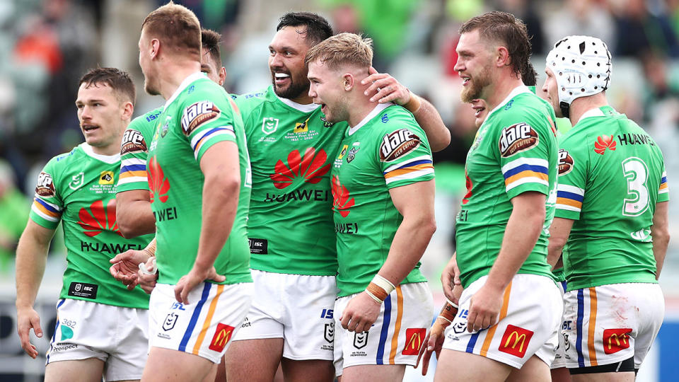 Seen here, Canberra Raiders players celebrate during a regular season match.