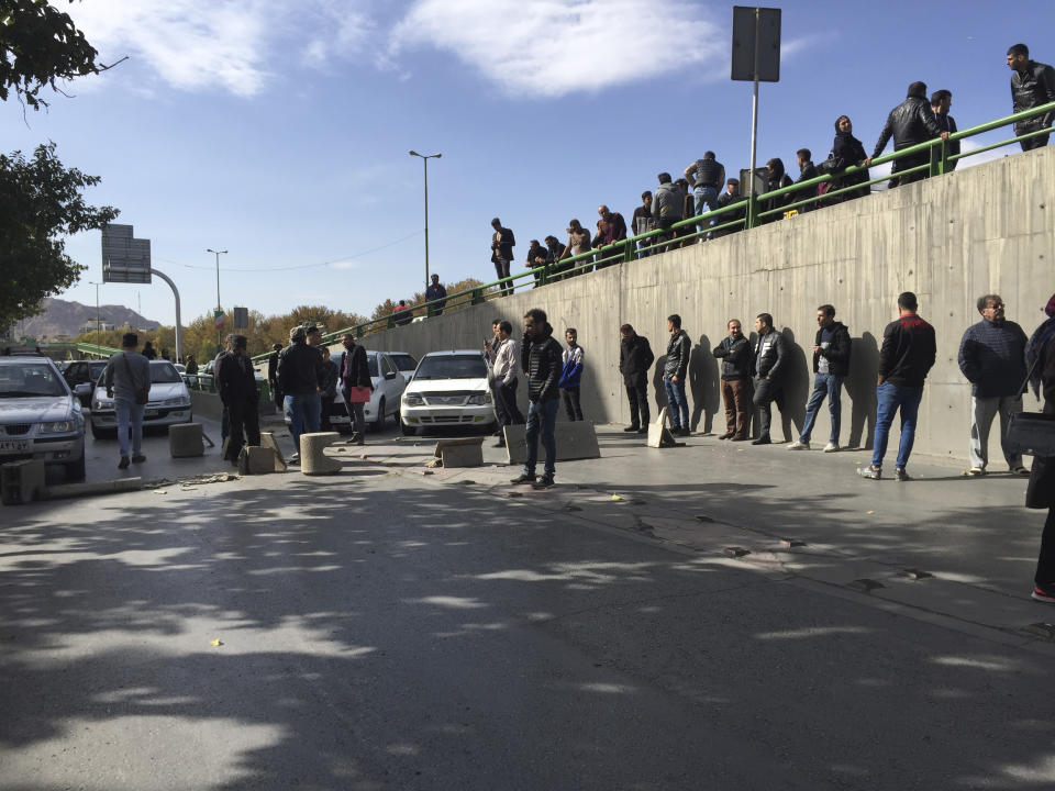 Demonstrators block a street during a protest after authorities raised gasoline prices, in the central city of Isfahan, Iran, Saturday, Nov. 16, 2019. Demonstrators angered by a 50% increase in government-set gasoline prices blocked traffic in major cities and occasionally clashed with police Saturday after a night of demonstrations punctuated by gunfire. (AP Photo)