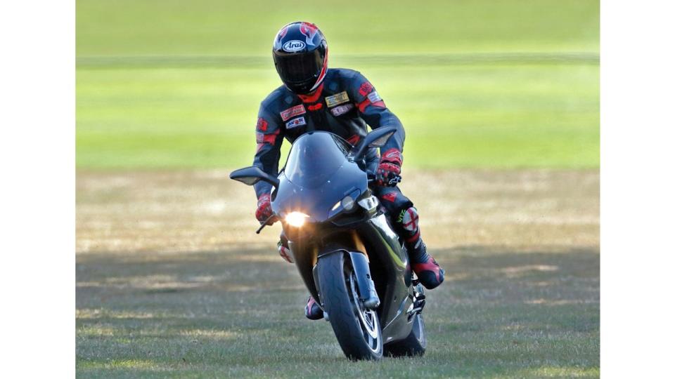 Prince William departs, riding his Ducati 1198S motorbike in 2009