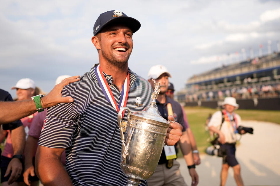 Bryson DeChambeau holds the trophy after winning the U.S. Open golf tournament Sunday, June 16, 2024, in Pinehurst, N.C. (AP Photo/Mike Stewart)