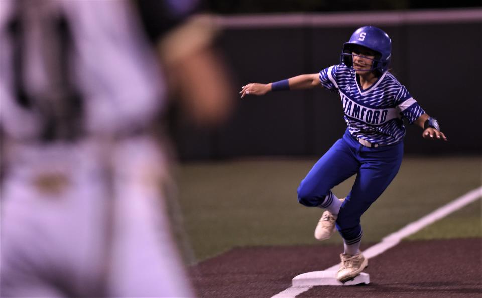 Stamford's Jacelyn Bell rounds third en route to an inside-the-park home run to lead off the fifth inning in Game 2 against Haskell. The homer gave Stamford a 10-2 lead.
