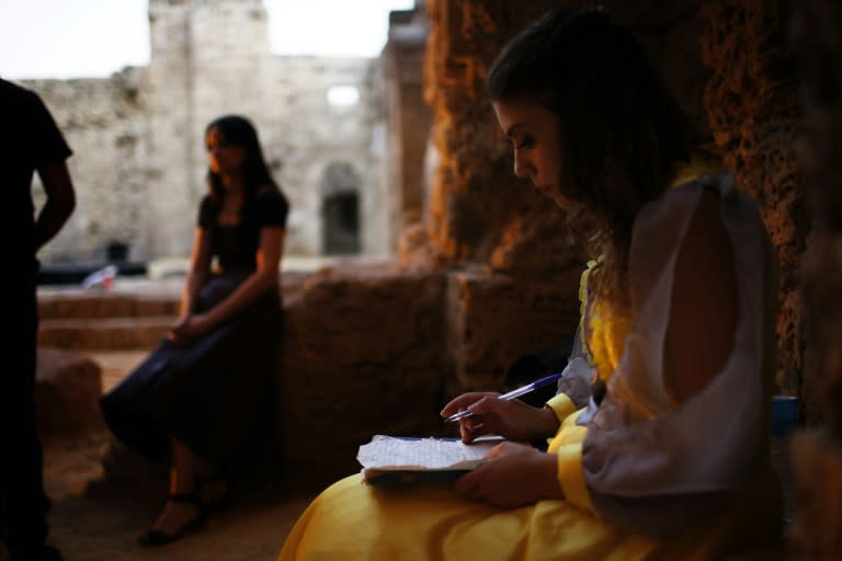 Greek and Turkish actors get ready before a performance of Shakespeare's Othello on July 2, 2015 at the Othello Tower in Famagusta