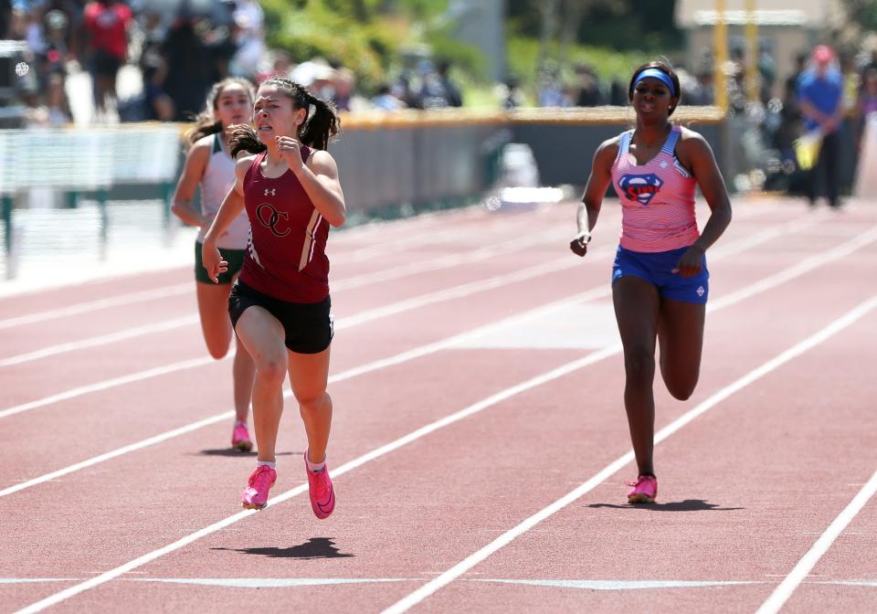 Oaks Christian's Rayah Rodriguez stretches out at the finish line to win the Division 4 girls 400-meter title at the CIF-Southern Section Track and Field Championships at Moorpark High on Saturday, May 13, 2023.