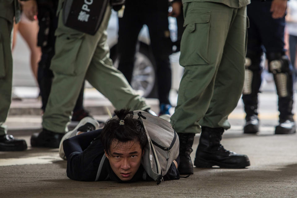 Image: Riot police detain a man as they clear protesters taking part in a rally against a new national security law in Hong Kong (Dale De La Rey / AFP - Getty Images file)