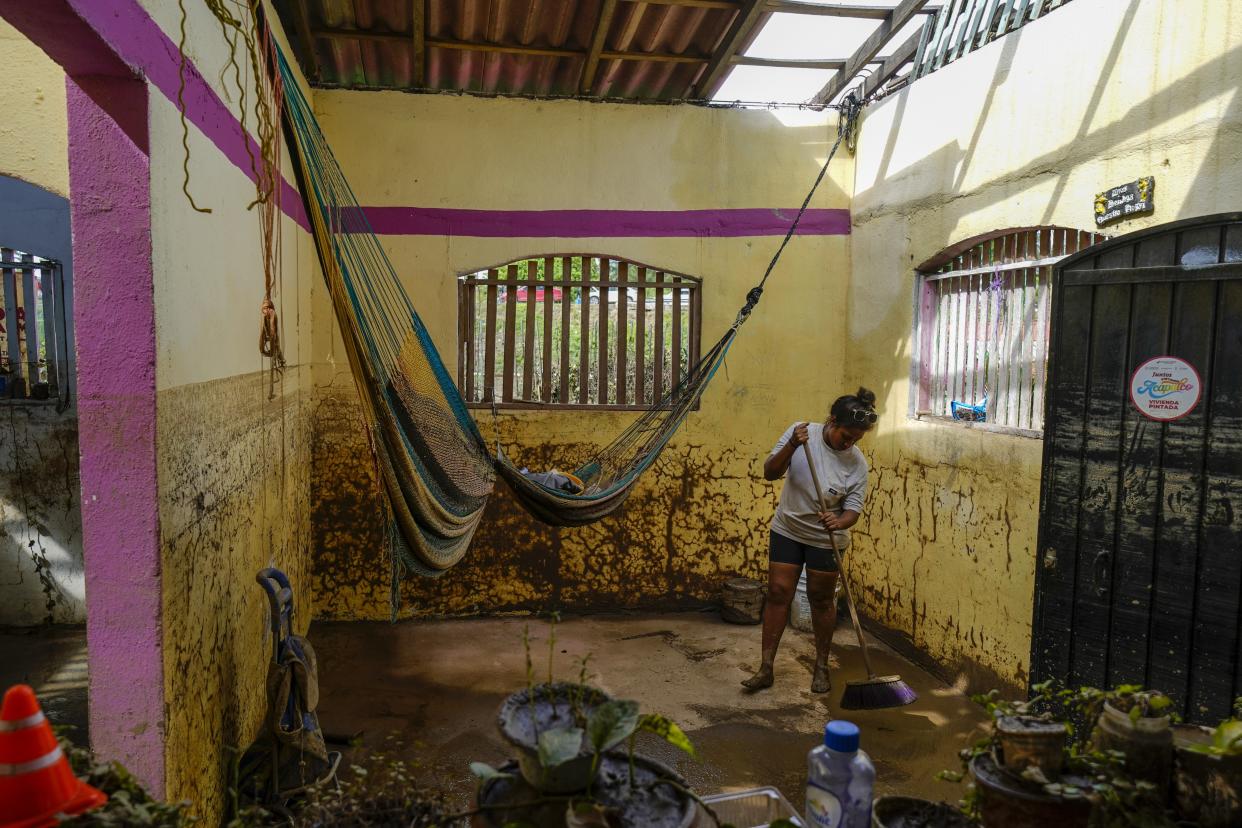 Yahaira Garcia, 32, cleans her damaged house after Hurricane John passed through Coyuca de Benitez, Guerrero state, Mexico, Monday, Sept. 30, 2024. (AP Photo/Felix Marquez)