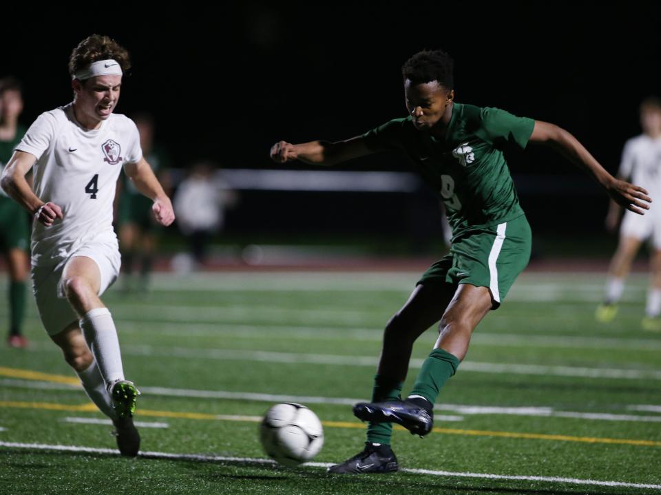 Spackenkill's Davis Barnes takes a shot ahead of O'Neill's Ben Yankovich during Thursday's Section 9 Class B semifinal on October 26, 2023.