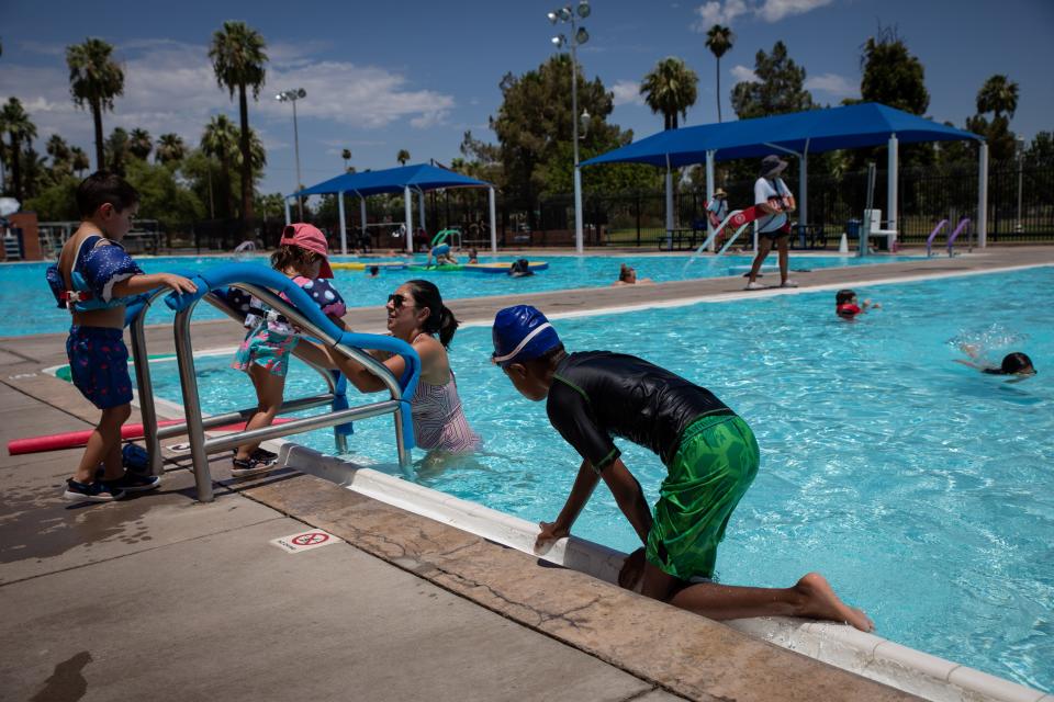 Children play in the water at the Encanto Park pool in Phoenix as temperatures top 112 degrees at noon on July 11, 2022.