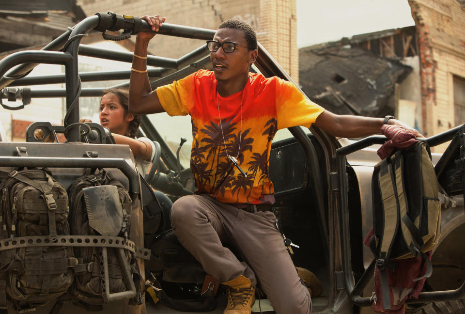 Jerrod leaning out of a military vehicle