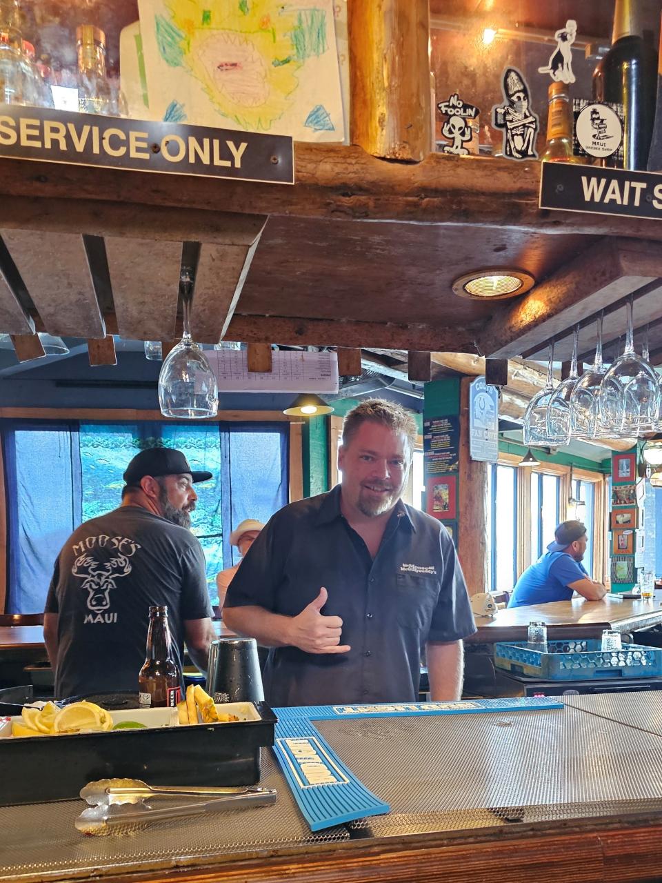 Kalkaska native Dave Heymes Jr. patrols the bar at Moose McGillycuddy’s in Kihei, Hawaii, where 49ers fans will gather Sunday while he roots for the Lions. Heymes was burned out of his home and job when Lahaina was destroyed in August.