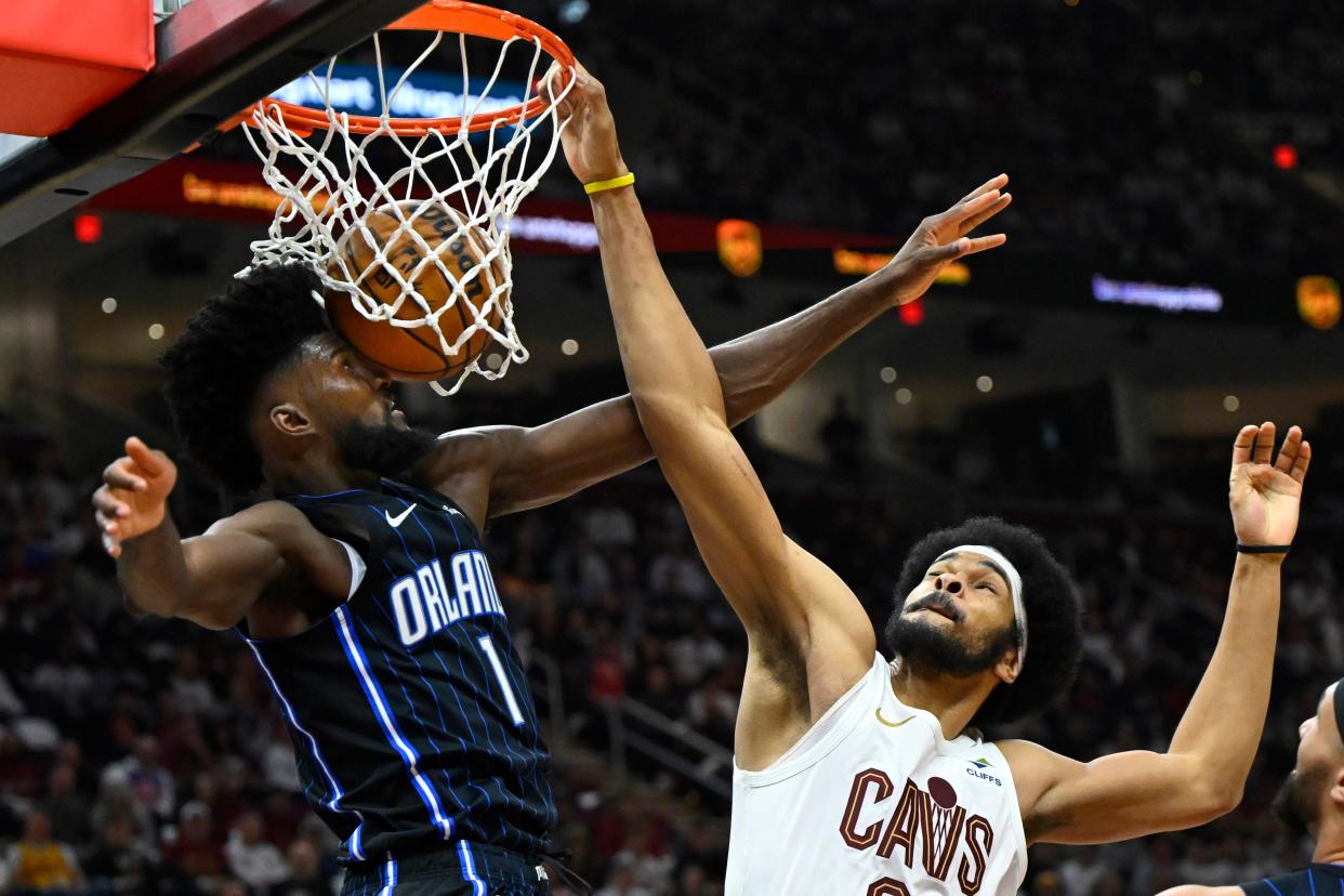 Cavaliers center Jarrett Allen dunks on Magic forward Jonathan Isaac in the second quarter of Game 1 of the first-round playoff series, April 20, 2024, in Cleveland.