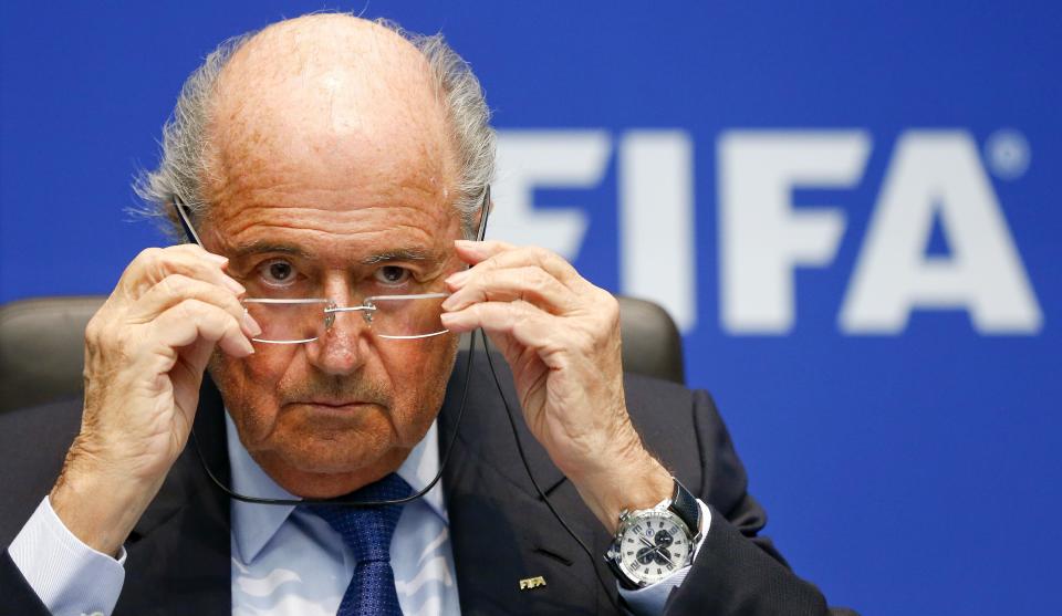 FIFA President Sepp Blatter adjusts his glasses as he addresses a news conference after a meeting of the FIFA executive committee in Zurich March 21, 2014. REUTERS/Arnd Wiegmann (SWITZERLAND - Tags: SPORT SOCCER HEADSHOT)
