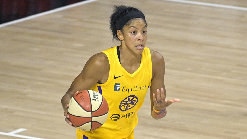 Los Angeles Sparks forward Candace Parker brings the ball up the court during the second half of a WNBA basketball game against the Washington Mystics, Thursday, Sept. 10, 2020, in Bradenton, Fla. (AP Photo/Phelan M. Ebenhack)