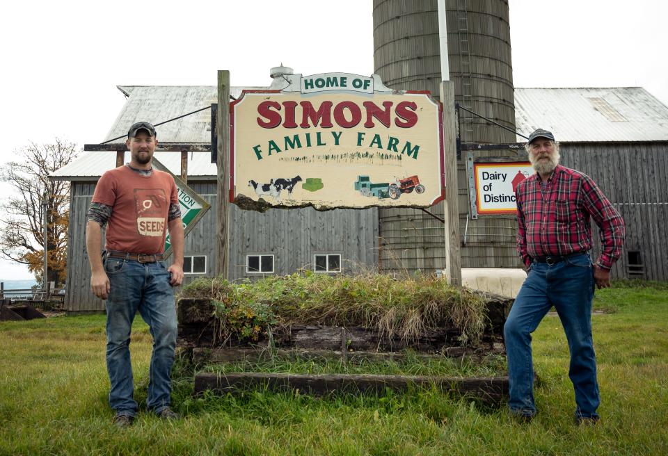 Ben Simons and his son Christopher are pictured in front of their farm's welcome sign atop of Starr Hill in Remsen, NY. Ben was approached by a land agent interested in leasing acres of Simons’ land to build an array of solar panels to convert the sun’s energy into electricity and deliver it to the state’s electrical grid.