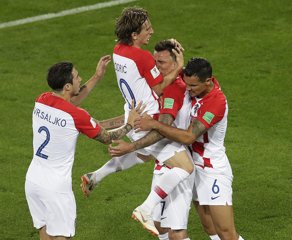 <p>Now more teammates join Mandzukic and Lovren in celebrating their goal. (AP) </p>