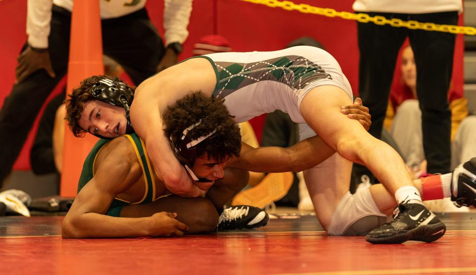Ridge’s Tim Kolshorn (red) beats Montgomery’s Jackson Obe (green) in the 138 weight class at the 2023 Somerset County Boys Wrestling Tournament on Jan. 7 at the gymnasium at Hillsborough High School in Hillsborough.