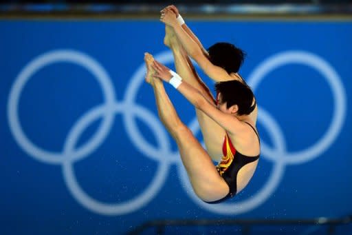 China's Chen Ruolin and Wang Hao compete in the women's synchronised 10m platform final at the London 2012 Olympic Games in London. They won gold