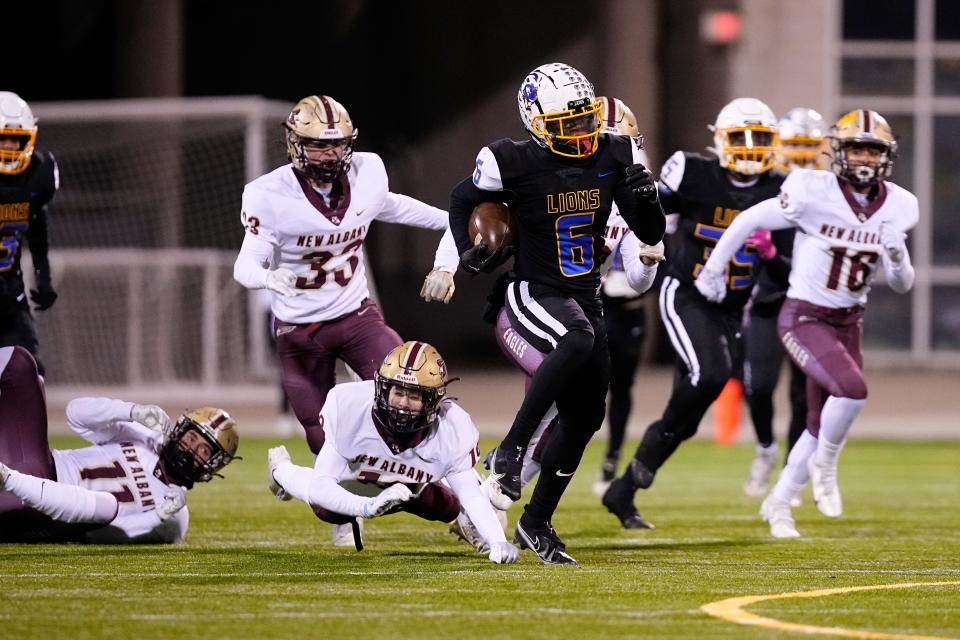 Nov 18, 2022; Columbus, Ohio, USA;  Gahanna's Makai Shahid (6) breaks a tackle from New Albany's Joey Skowron (19) on his way to a kickoff return touchdown during the second half of the high school football Div. I regional final at Historic Crew Stadium. Gahanna won 25-17. Mandatory Credit: Adam Cairns-The Columbus Dispatch