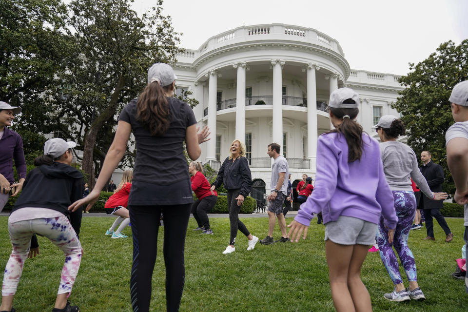 First lady Jill Biden walks though kids and families as they workout during the Joining Forces Military Kids Workout on the South Lawn of the White House in Washington, Saturday, April 29, 2023. The event is in honor of the Month of the Military Child. (AP Photo/Carolyn Kaster)