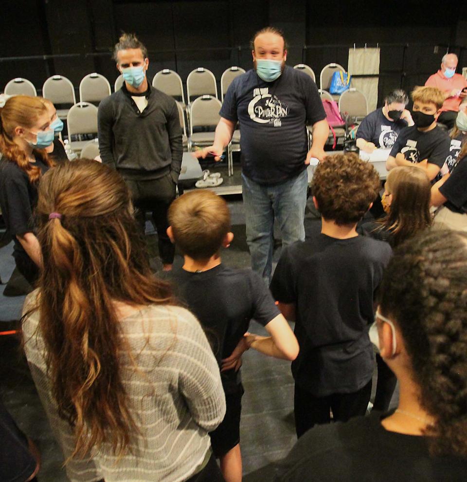 Director Jordan Cooper, center, speaks to the cast before an All-City Musical rehearsal of "Peter Pan" at the University of Akron.