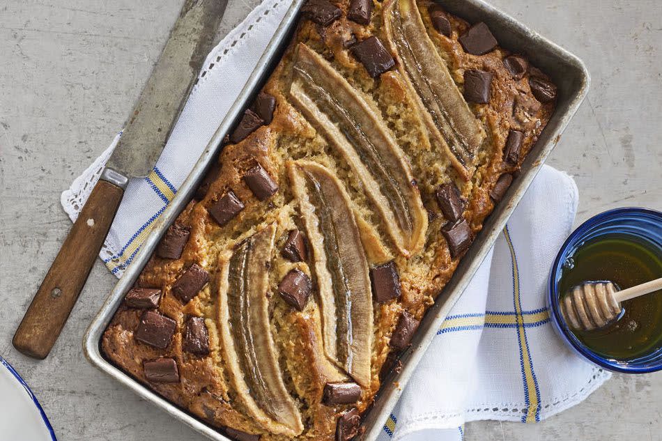 <p>A bit of Greek yogurt gives this ooey bread some lightness, but it's the roasted banana halves and the giant chunks of chocolate, of course, that make it completely irresistible.</p><p><strong><a href="https://www.countryliving.com/food-drinks/recipes/a41637/one-bowl-chocolate-banana-bread-recipe/" rel="nofollow noopener" target="_blank" data-ylk="slk:Get the recipe;elm:context_link;itc:0;sec:content-canvas" class="link ">Get the recipe</a>.</strong></p><p><a class="link " href="https://www.amazon.com/USA-Pan-1140LF-Bakeware-Aluminized/dp/B0029JQEIC/?tag=syn-yahoo-20&ascsubtag=%5Bartid%7C10050.g.35246097%5Bsrc%7Cyahoo-us" rel="nofollow noopener" target="_blank" data-ylk="slk:SHOP LOAF PANS;elm:context_link;itc:0;sec:content-canvas">SHOP LOAF PANS</a><br></p>