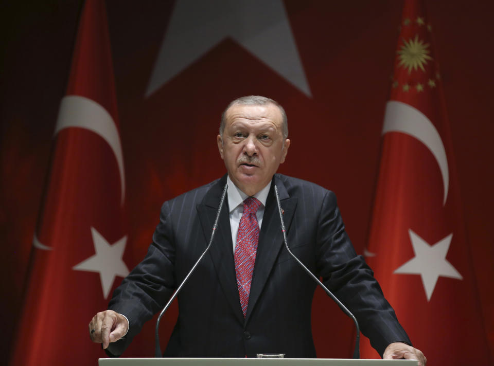 Turkey's President Recep Tayyip Erdogan addresses his party members, in Ankara, Turkey, Thursday, Aug. 13, 2020. Greece’s prime minister has warmly thanked France for its decision to boost its military presence in the eastern Mediterranean, where Greek and Turkish warships are closely shadowing each other over a Turkish energy exploration bid in waters Athens claims as its own. (Turkish Presidency via AP, Pool)