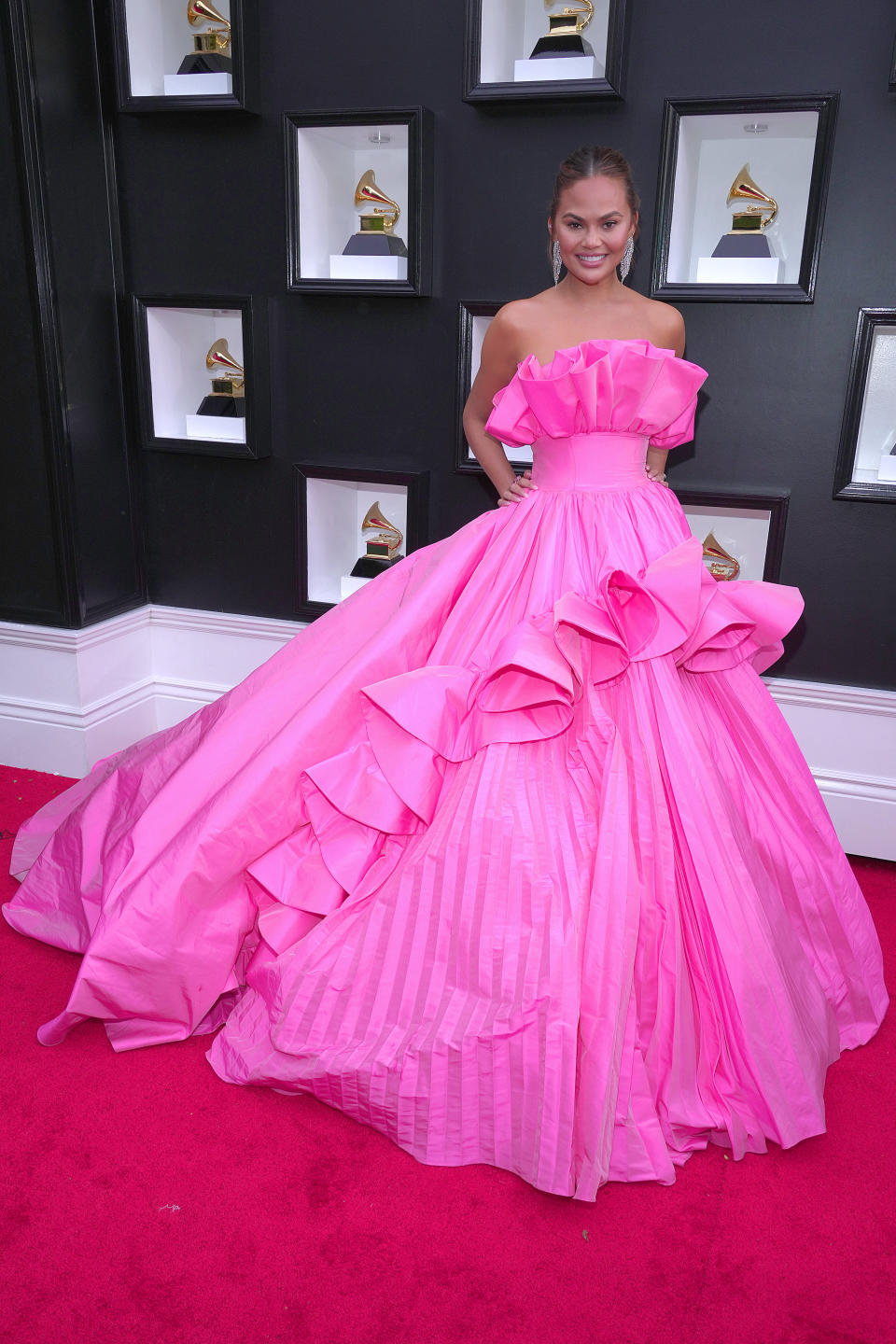 Chrissy Teigen at the 2022 Grammy Awards. (Image via Getty Images)