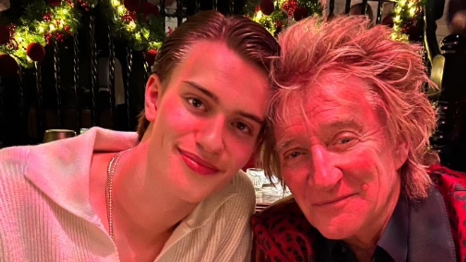 Alastair and Rod Stewart sat at a restaurant