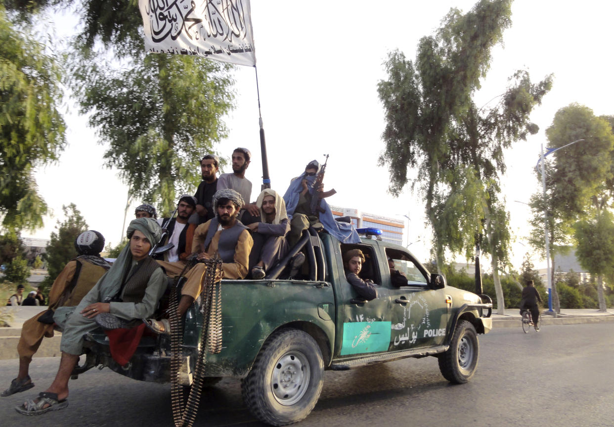 Taliban fighters patrol inside the city of Kandahar, southwest Afghanistan, Sunday, Aug. 15, 2021. (AP Photo/Sidiqullah Khan)