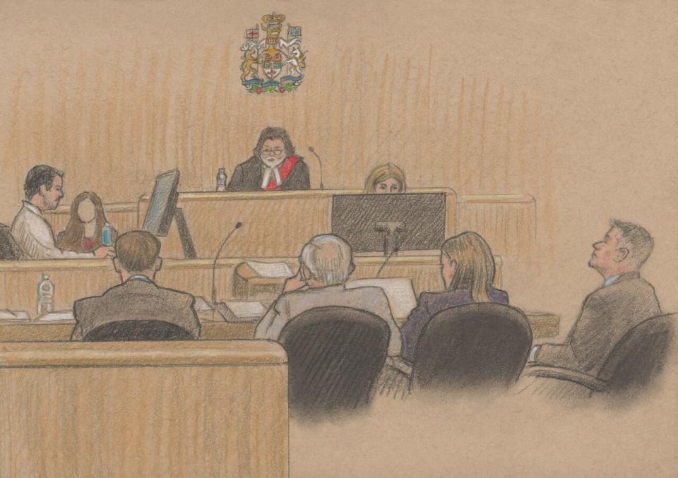 Edmundson, seated on the far right beside his lawyers,  is being tried in the Ontario Court of Justice by a judge alone