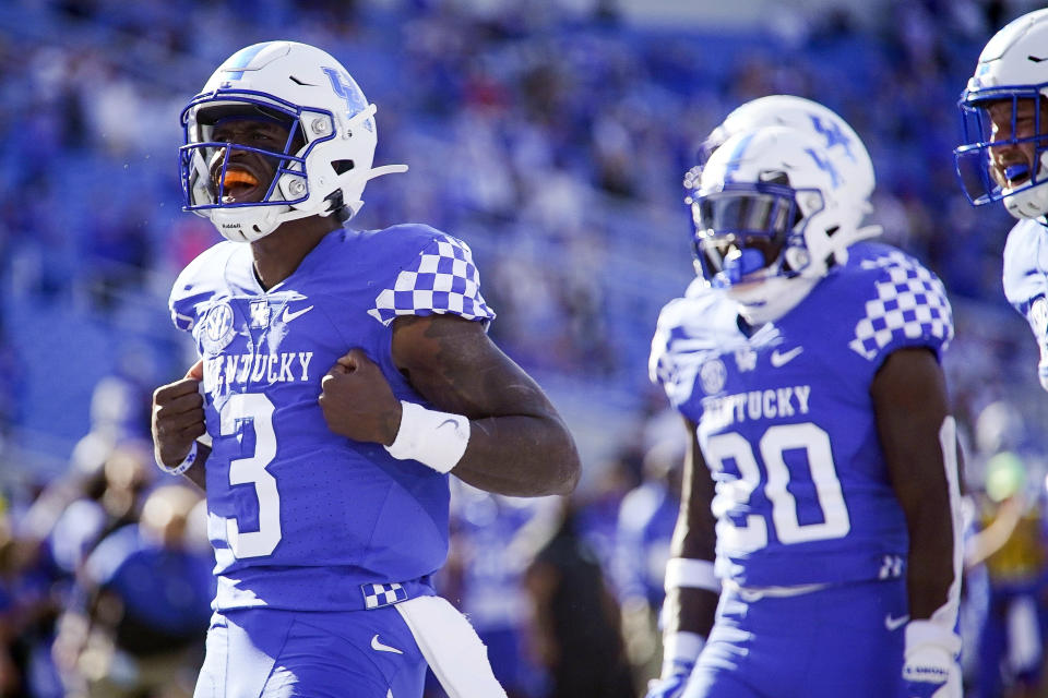 Kentucky quarterback Terry Wilson (3) celebrates after scoring a touchdown during the first half of an NCAA college football game against Mississippi, Saturday, Oct. 3, 2020, in Lexington, Ky. (AP Photo/Bryan Woolston)