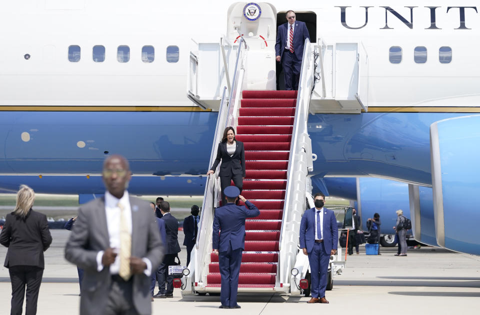 Vice President Kamala Harris is greeted by United States Air Force Lt. Col. Neil Senkowski as she deplanes Air Force Two after a technical issue forced the aircraft to return and land at Andrews Air Force Base, Md., Sunday, June 6, 2021, as she was en route to Guatemala City. (AP Photo/Jacquelyn Martin)