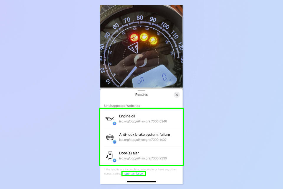 A screenshot showing how to use Visual Look Up to identify dashboard lights on iPhone