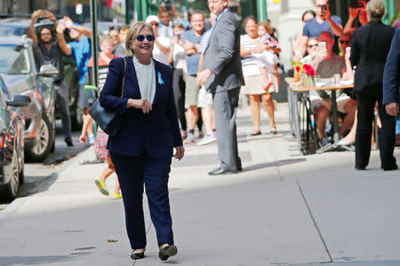 U.S. Democratic presidential candidate Hillary Clinton leaves her daughter Chelsea's home in New York, New York, United States September 11, 2016, after Clinton left ceremonies commemorating the 15th anniversary of the September 11 attacks feeling "overheated." REUTERS/Brian Snyder