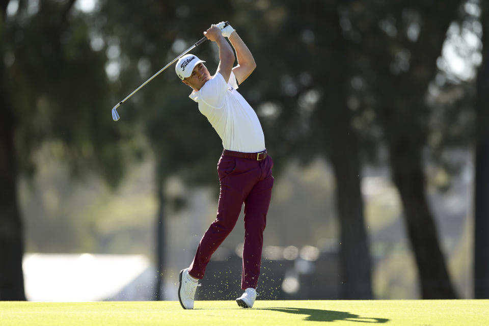 Justin Thomas watches his second shot on the 11th hole during the second round of the Genesis Invitational golf tournament at Riviera Country Club, Friday, Feb. 18, 2022, in the Pacific Palisades area of Los Angeles. (AP Photo/Ryan Kang)