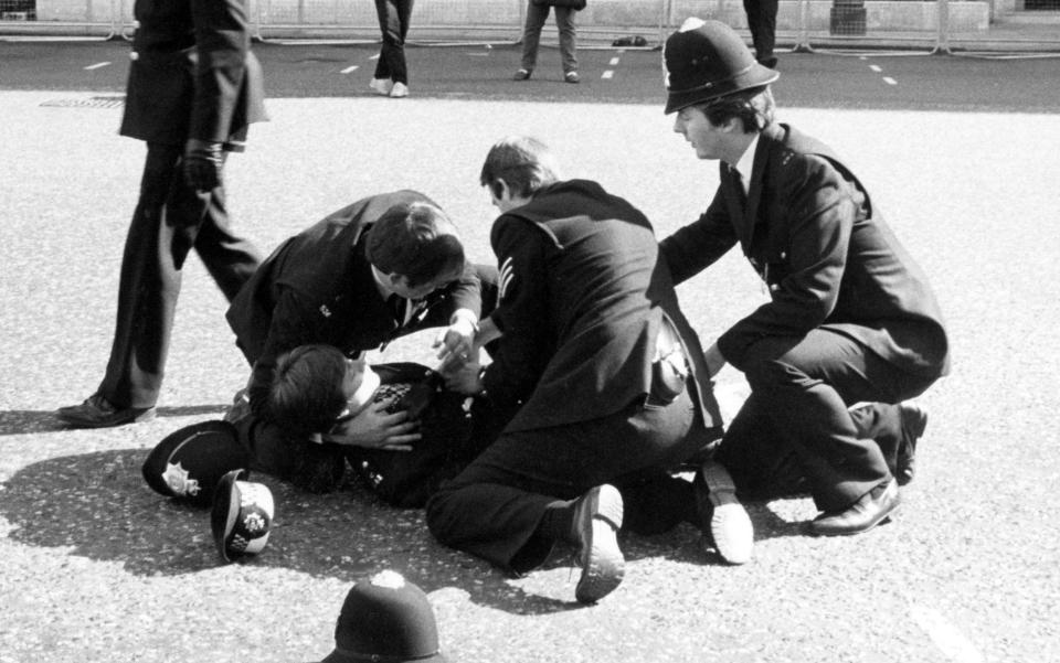 John Murray, left, cradles Yvonne Fletcher after the shooting in 1984