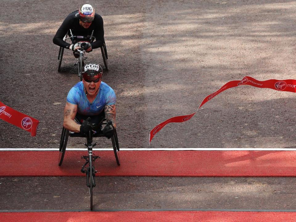 Weir crosses the line in the men's wheelchair race (Getty)