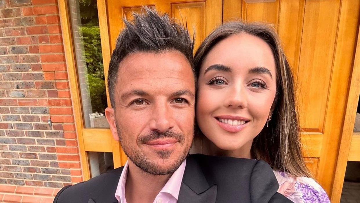 Emily Andre and Peter Andre smiling for a selfie