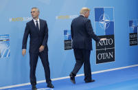 <p>President Trump gestures as he walks away after being greeted by NATO Secretary-General Jens Stoltenberg, left, before a summit of heads of state and government at NATO headquarters in Brussels on Wednesday, July 11, 2018. NATO leaders gathered in Brussels for a two-day summit to discuss Russia, Iraq and their mission in Afghanistan. (Photo: Pablo Martinez Monsivais/AP) </p>