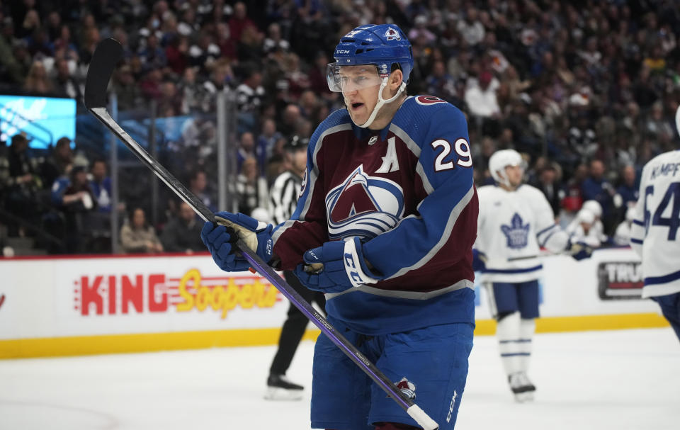 Colorado Avalanche center Nathan MacKinnon argues with an official for a call during the second period of the team's NHL hockey game against the Toronto Maple Leafs on Saturday, Dec. 31, 2022, in Denver. (AP Photo/David Zalubowski)