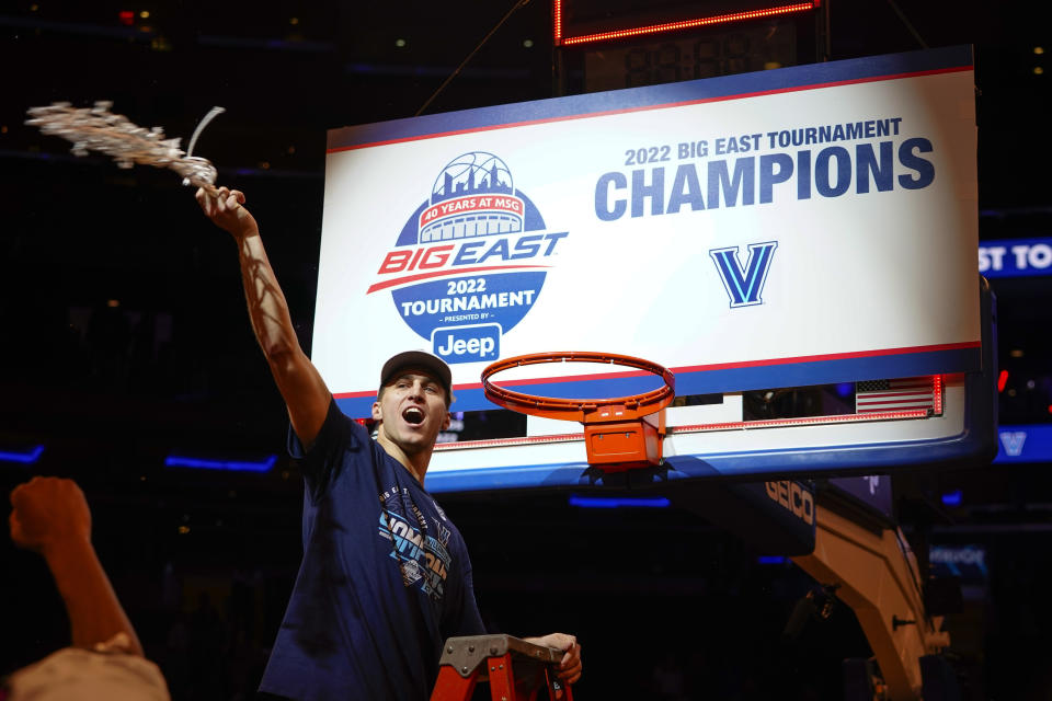 Villanova's Collin Gillespie celebrates after cutting down the net after the final of the Big East conference tournament against Creighton, Saturday, March 12, 2022, in New York. (AP Photo/Frank Franklin II)