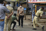 MUMBAI, INDIA - MARCH 24: Mumbai Police checking ID card during restrictions on citizens movement at Ramabi nagar ghatkopar ddue to COVID 19 Pandemic, on March 24, 2020 in Mumbai, India. (Photo by Vijayanand Gupta/Hindustan Times via Getty Images)