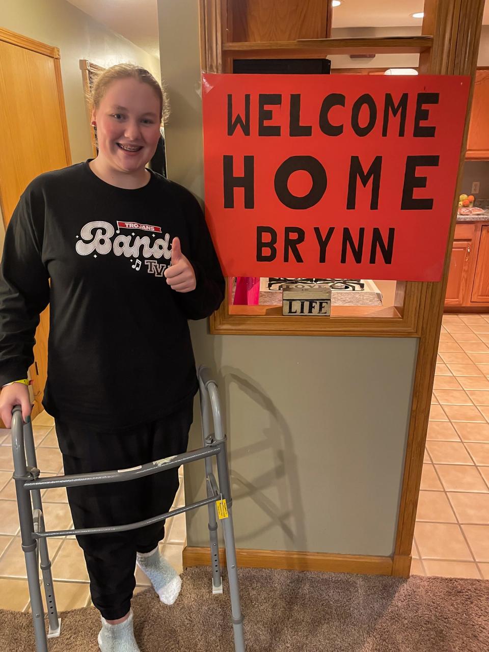 After being severely injured in a crash on Nov. 14, Brynn Goedel is able to get around with the help of a walker.