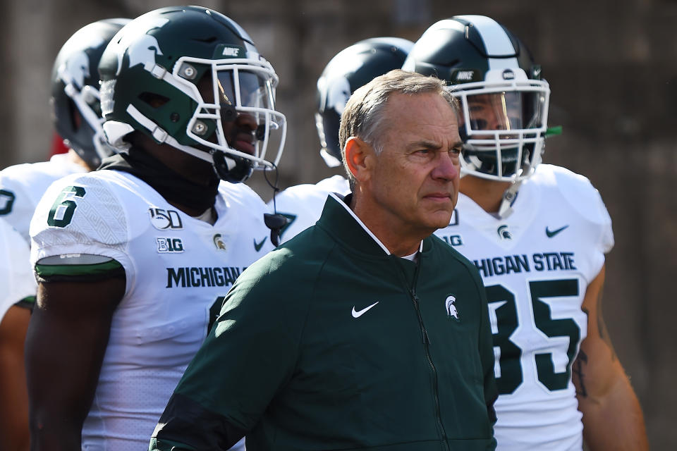 Head coach Mark Dantonio of the Michigan State Spartans takes the field with his team prior to a game against the Wisconsin Badgers (Getty)