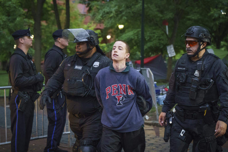 Police detain a protester on the University of Pennsylvania campus, in Philadelphia, on Friday, May 10, 2024. (Jessica Griffin/The Philadelphia Inquirer via AP)