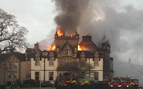 Flames and smoke billow from the Cameron House Hotel on the banks of Loch Lomond - Credit: Phil Dye /Daily Record