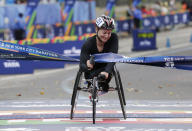 <p>Manuela Schar of Switzerland crosses the finish line first in the women’s wheelchair division of the New York City Marathon in New York, Sunday, Nov. 5, 2017. (Photo: Seth Wenig/AP) </p>