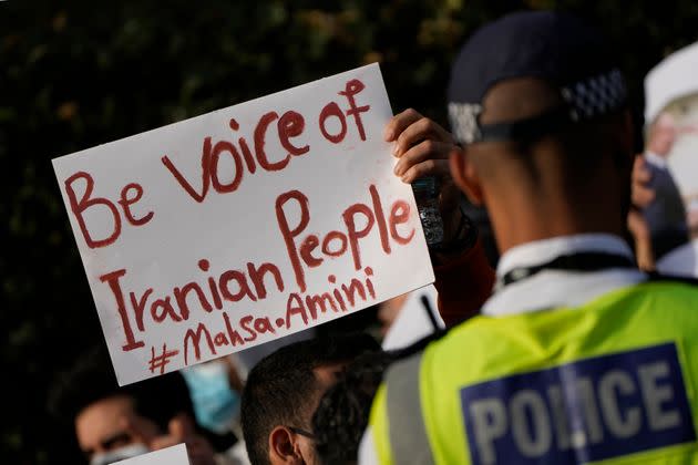 Demonstrators hold placards Sunday outside the Iranian Embassy in London to protest the death of Iranian Mahsa Amin. (Photo: Alastair Grant/AP)