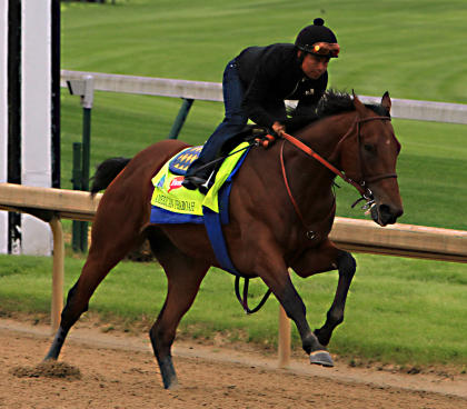 Martin Garcia rides Kentucky Derby hopeful American Pharoah during a morning workout. (AP)