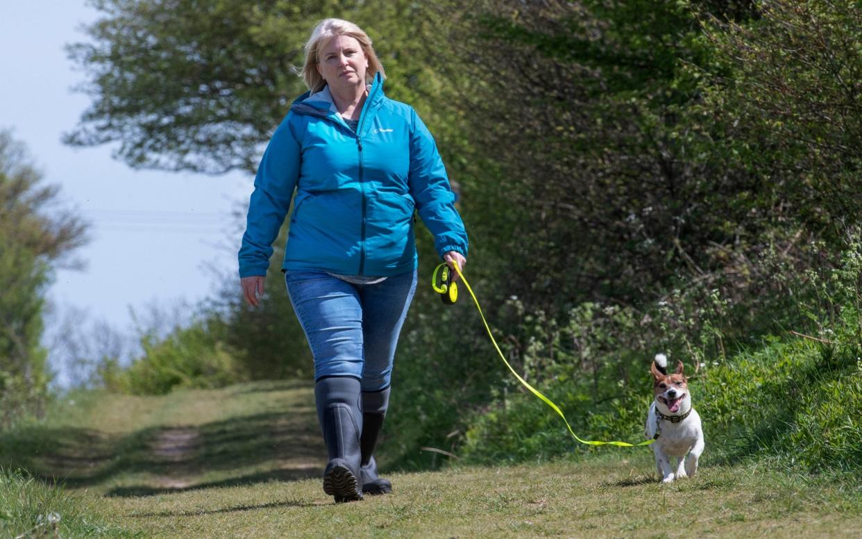 An actress, wearing the same outfit as PCSO Julia James, leads Toby as the pair retraced her steps as she went on her final walk