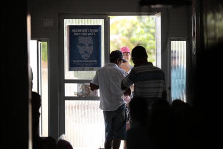 Patients wait for the arrival of Cuban doctor Dania Rosa Alvero Pez, who works at the Health Center at the city of Jiquitaia in the state of Bahia, north-eastern Brazil, November 18, 2013. REUTERS/Ueslei Marcelino